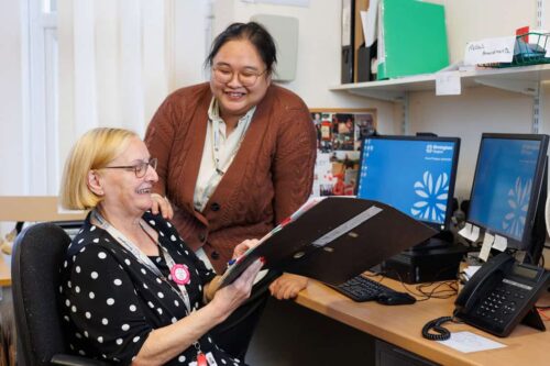 Two office team members