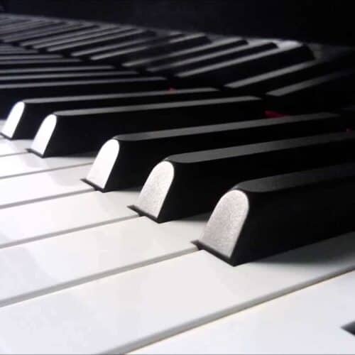 A close-up on the keys of a piano.