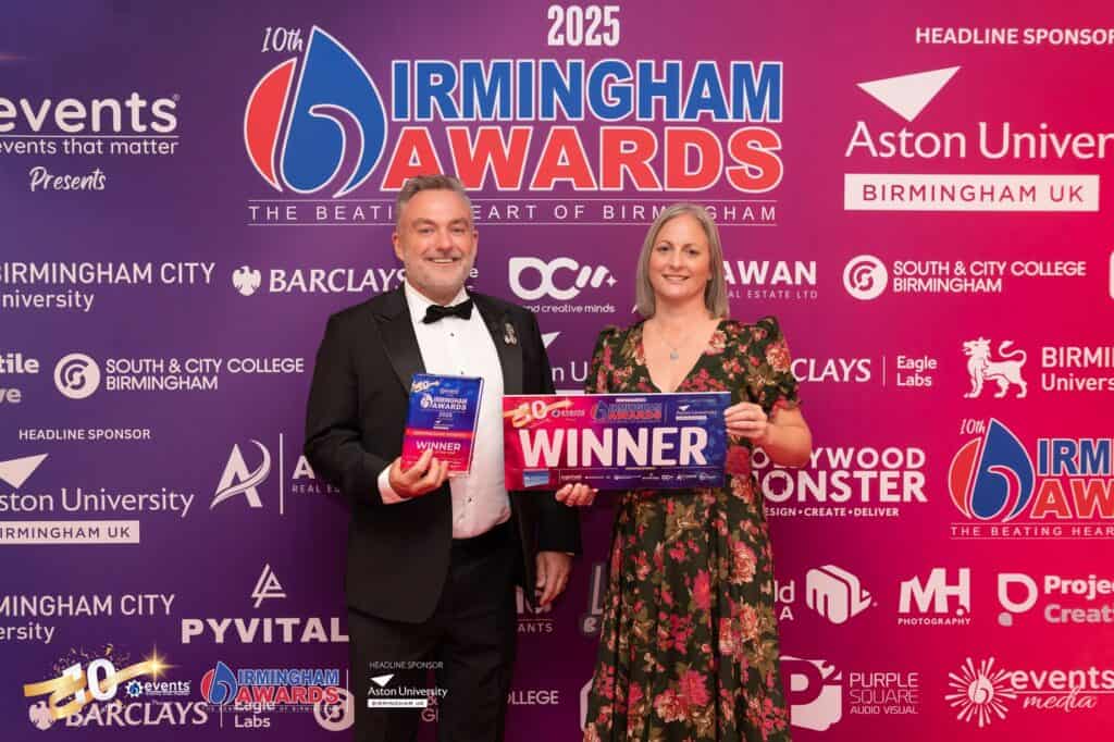 Paul Bytheway, Chief Executive, and Lucy Watkins, Income Generation Director, with the award.